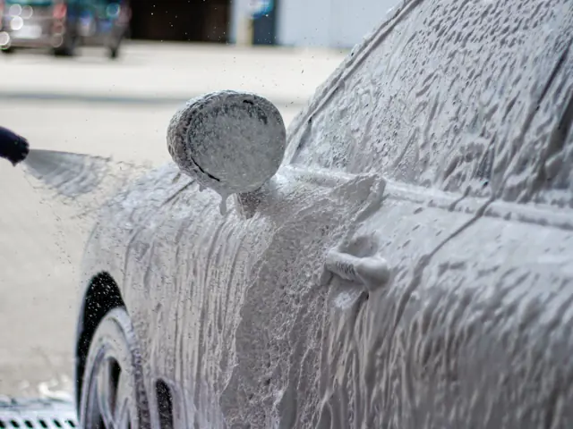 Car covered with LITE Foam active foam at a touchless car wash