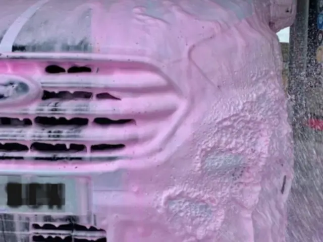 FUNKY FOAM pink active foam on a car at a BKF car wash