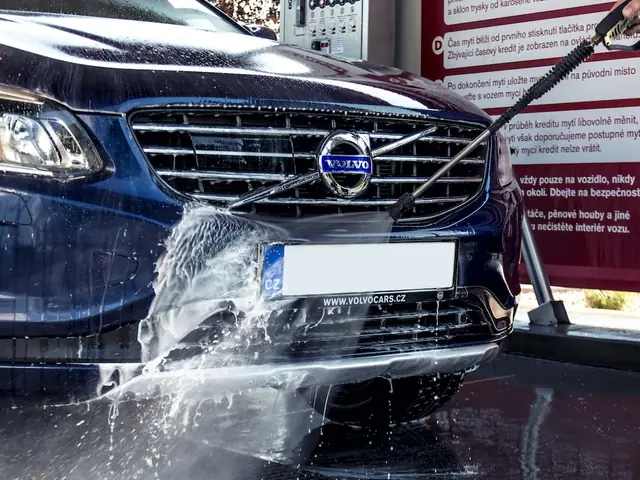 Self-service touchless car wash bay with chemicals being applied