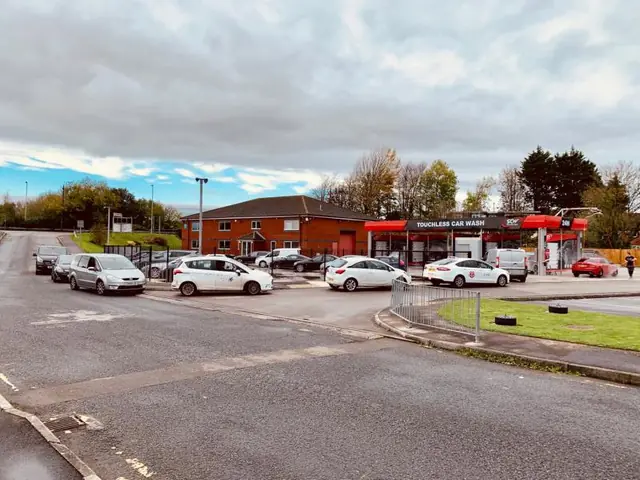 Queue of cars at the opening of the self-service car wash in Bridgend