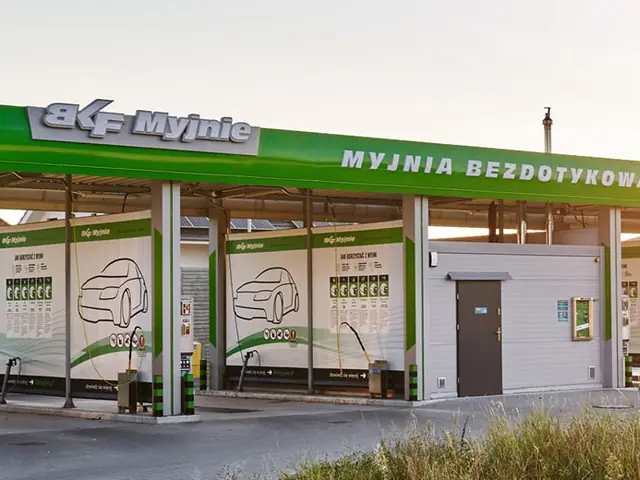 Night view of the illuminated BKF car wash in Środa Wielkopolska