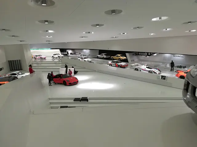 Row of Porsche cars in the museum