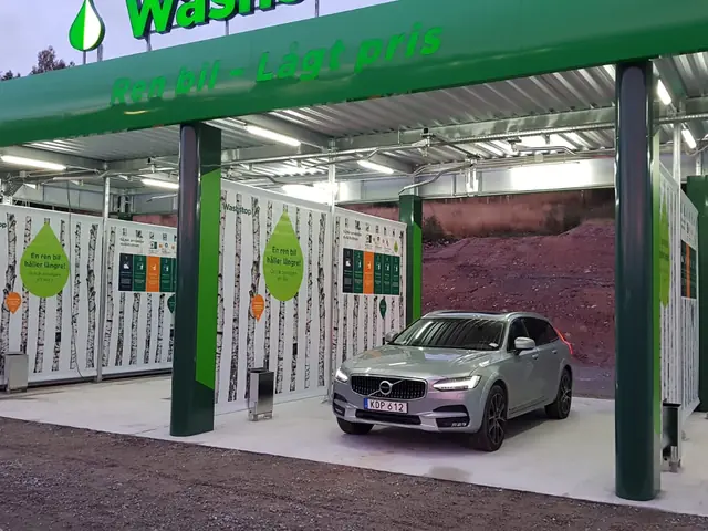 Washing bays of the Washstop car wash in green and white colours